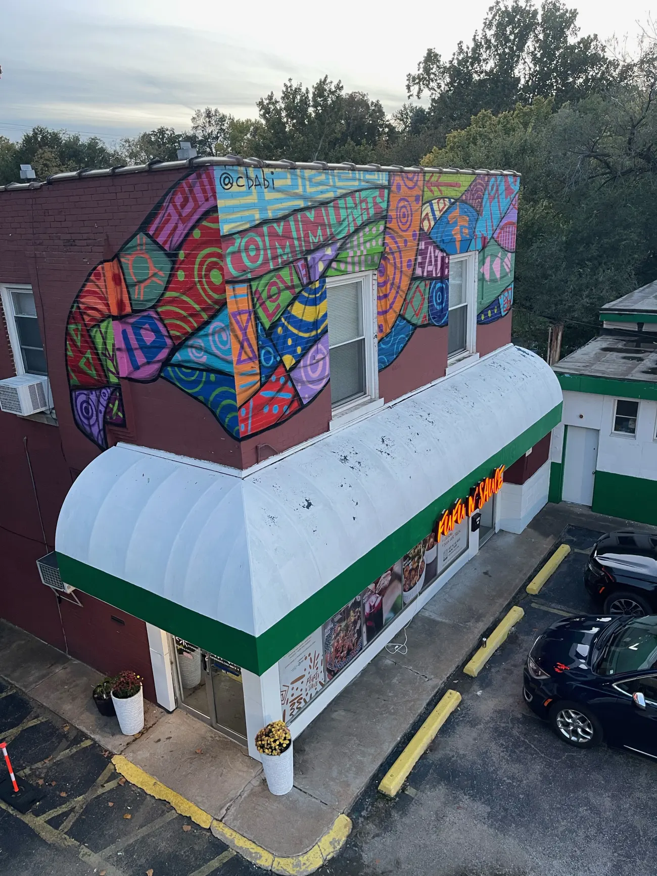 FUFU n' Sauce storefront mural on Page Ave